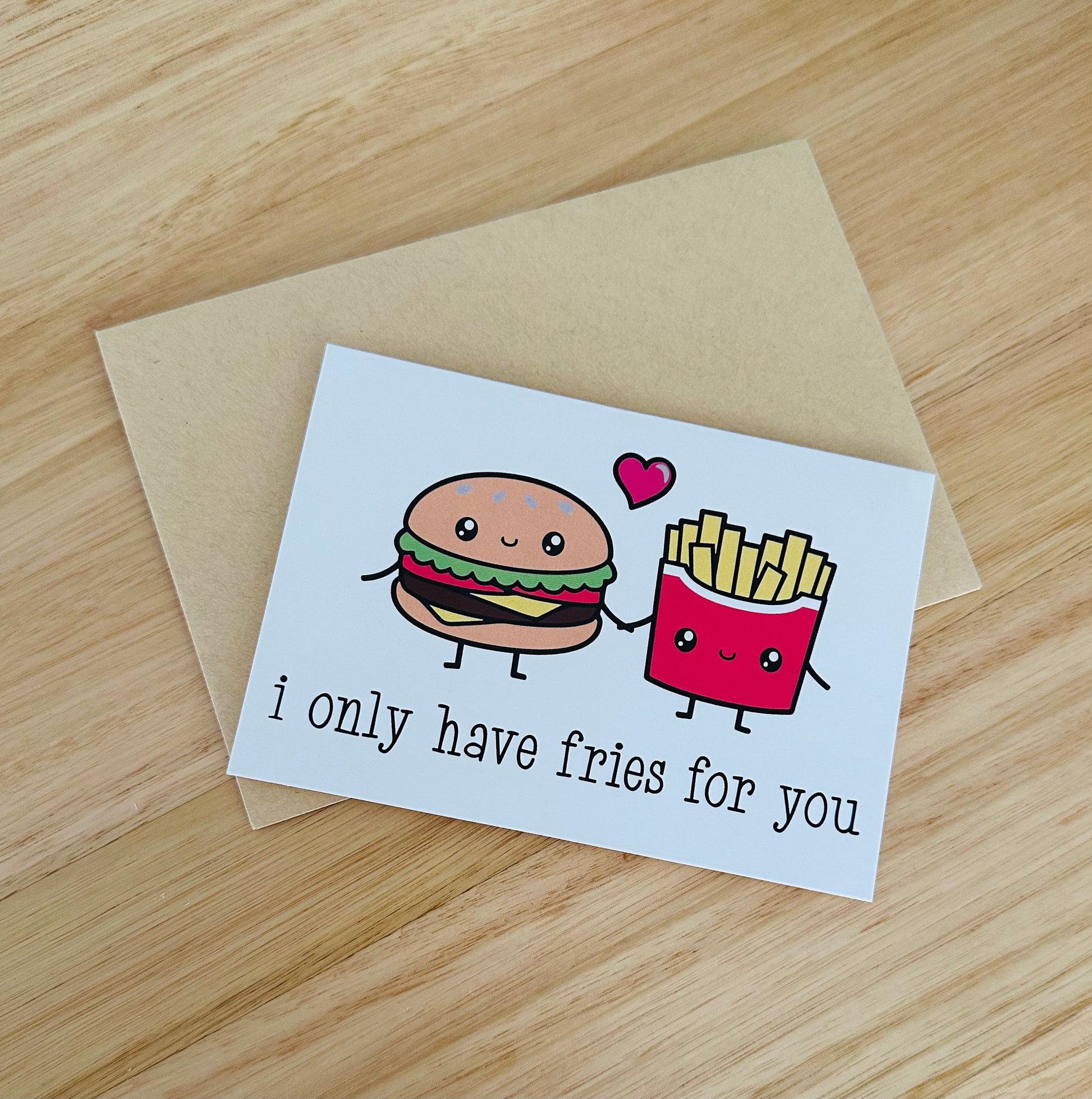 Cute greeting card with smiling burger and fries cartoon, heart, and 'I only have fries for you' text